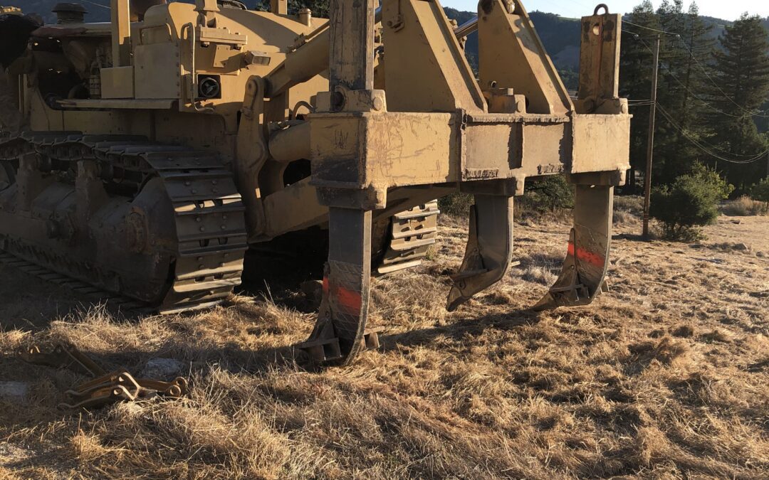 Heavy machinery for ripping the soil